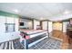 Entertaining basement featuring an air hockey table, TV, and ample storage space, perfect for recreation and relaxation at 3765 11Th Ne St, Hickory, NC 28601