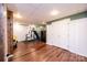 Basement gym area with exercise equipment, weights, and a mirrored wall, complete with durable vinyl flooring at 3765 11Th Ne St, Hickory, NC 28601