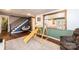 Finished basement with a cozy seating area, playful wooden play structure, and stylish wood-look flooring at 3765 11Th Ne St, Hickory, NC 28601