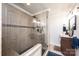 Bathroom featuring a walk-in shower with glass door, updated fixtures, and a vanity at 3765 11Th Ne St, Hickory, NC 28601