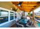 Covered patio with a wooden ceiling, ceiling fans, outdoor seating, and views of the backyard at 3765 11Th Ne St, Hickory, NC 28601