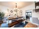 Bright dining room with rustic wood table and benches, view of the kitchen, and charming decor at 3765 11Th Ne St, Hickory, NC 28601