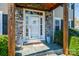 A welcoming front entrance features stone accents, a covered porch, and decorative details at 3765 11Th Ne St, Hickory, NC 28601
