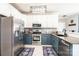 Spacious kitchen with stainless steel appliances, granite countertops, tile flooring, and ample cabinet space at 3765 11Th Ne St, Hickory, NC 28601