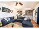 Open-concept living room with a large sectional sofa, hardwood floors, and stylish accents at 3765 11Th Ne St, Hickory, NC 28601
