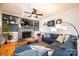 Cozy living room with a stone fireplace, built-in shelves, hardwood floors, and comfortable seating at 3765 11Th Ne St, Hickory, NC 28601