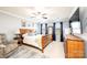 Comfortable main bedroom with a wooden bed frame, a ceiling fan, large dresser, and neutral decor at 3765 11Th Ne St, Hickory, NC 28601