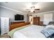 Spacious main bedroom features wood furniture, TV, neutral paint, and large windows at 3765 11Th Ne St, Hickory, NC 28601