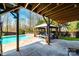 Covered patio area next to a swimming pool, complete with a gazebo and comfortable outdoor seating at 3765 11Th Ne St, Hickory, NC 28601