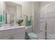 Modern bathroom featuring a vanity with a sink and a plant, a toilet, and a shower at 4104 Armstrong Farm Dr, Belmont, NC 28012