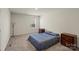Cozy bedroom with a comfortable bed, carpet flooring, and a minimalist decor style at 4104 Armstrong Farm Dr, Belmont, NC 28012