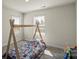 Cozy bedroom featuring a play teepee, carpet, and natural light from two windows at 4104 Armstrong Farm Dr, Belmont, NC 28012