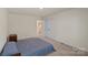This bedroom features a comfortable bed, carpet flooring, and closet space at 4104 Armstrong Farm Dr, Belmont, NC 28012