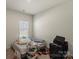 Bedroom with a window, carpet, and a bed with various shoes, suitcases, and personal items at 4104 Armstrong Farm Dr, Belmont, NC 28012