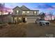 Charming two-story home featuring a well-maintained lawn, a two-car garage, and neutral-colored siding at 4104 Armstrong Farm Dr, Belmont, NC 28012