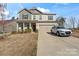 Charming two-story home featuring a well-maintained lawn, a two-car garage, and neutral-colored siding at 4104 Armstrong Farm Dr, Belmont, NC 28012