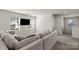 Upstairs living room featuring a comfortable sectional sofa and a wall-mounted television at 4104 Armstrong Farm Dr, Belmont, NC 28012