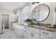 This bathroom features a modern tub, dual vanities with granite counters, and ample natural light at 4210 Holly Ne Cir, Conover, NC 28613