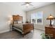 Bedroom featuring a ceiling fan, a window with blinds, and a traditional-style bed frame at 4210 Holly Ne Cir, Conover, NC 28613