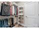 This walk-in closet offers ample storage with shelving, hanging space, and room for shoes and accessories at 4210 Holly Ne Cir, Conover, NC 28613