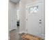 Bright entryway with a glass-paneled front door and views to an adjacent bedroom at 4210 Holly Ne Cir, Conover, NC 28613