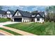 Charming single-story home featuring a well-manicured lawn, brick facade, and a paved walkway leading to the entrance at 4210 Holly Ne Cir, Conover, NC 28613