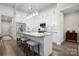 Modern kitchen with white cabinets, stainless steel appliances, and a center island with seating at 4210 Holly Ne Cir, Conover, NC 28613
