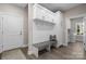 Welcoming mudroom with built-in storage, bench, hooks, and convenient access to the laundry area at 4210 Holly Ne Cir, Conover, NC 28613