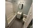 A full bathroom includes a bathtub, toilet, and single sink vanity at 4510 Wildwood Ave, Charlotte, NC 28208