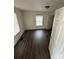 A bedroom features a neutral color palette, providing a calming and adaptable space at 4510 Wildwood Ave, Charlotte, NC 28208