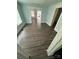 A spacious living room with freshly painted light blue walls and wood flooring at 4510 Wildwood Ave, Charlotte, NC 28208