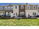 Townhome backyard features a stone and beige exterior with patio and seating at 4644 Craigmoss Ln, Charlotte, NC 28278