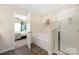 Bathroom including a shower and a view of the bedroom at 4644 Craigmoss Ln, Charlotte, NC 28278