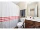 Bright bathroom featuring a single vanity and a shower and bath at 4644 Craigmoss Ln, Charlotte, NC 28278