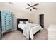 Bright bedroom featuring a high ceiling with a ceiling fan, comfortable bed and light-colored walls at 4644 Craigmoss Ln, Charlotte, NC 28278