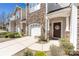 Charming front entrance with a decorative wreath on the door, stone accents, and manicured landscaping at 4644 Craigmoss Ln, Charlotte, NC 28278
