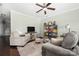 Cozy living room with a ceiling fan, lots of natural light, and comfortable seating at 4644 Craigmoss Ln, Charlotte, NC 28278