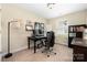 Cozy home office space with a black desk, comfortable chair and natural light at 4644 Craigmoss Ln, Charlotte, NC 28278