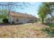 Home backyard featuring a covered patio, siding, and greenery at 5291 Moonlight Sw Trl, Concord, NC 28025