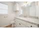 Bright bathroom features a granite countertop, white cabinets, and a gold-toned fixture at 5291 Moonlight Sw Trl, Concord, NC 28025