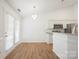 Dining area featuring modern lighting, wainscoting, and easy access to the kitchen at 5291 Moonlight Sw Trl, Concord, NC 28025