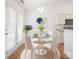 Bright dining area featuring a modern chandelier, glass table, and french doors at 5291 Moonlight Sw Trl, Concord, NC 28025