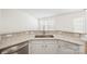 Kitchen area boasting granite countertops, stainless steel appliances and modern faucet at 5291 Moonlight Sw Trl, Concord, NC 28025