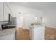 Kitchen featuring stainless steel appliances, granite countertops and bar-style seating at 5291 Moonlight Sw Trl, Concord, NC 28025