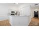 Bright kitchen with white cabinets, stainless steel appliances, and granite countertops at 5291 Moonlight Sw Trl, Concord, NC 28025
