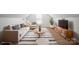 Stylishly staged living room with plush seating, modern decor, and ample natural light at 5291 Moonlight Sw Trl, Concord, NC 28025
