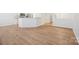 Bright living space with wood floors and an open layout to the kitchen at 5291 Moonlight Sw Trl, Concord, NC 28025