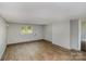 Versatile bonus room with laminate flooring and abundant natural light, ideal for recreation or relaxation at 5323 Hilltop Cir, Charlotte, NC 28269
