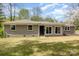 Charming home featuring a well-maintained lawn and neutral exterior color scheme, nestled among lush greenery at 5323 Hilltop Cir, Charlotte, NC 28269
