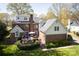 Aerial view of a brick home with a wooden deck and a well-maintained lawn at 5419 Sunningdale Dr, Charlotte, NC 28277
